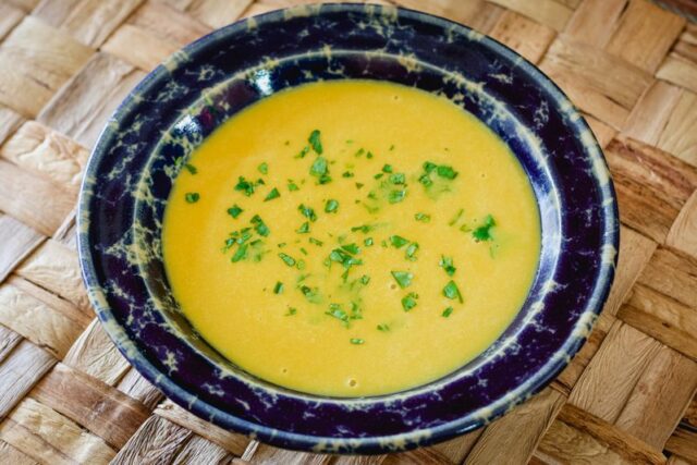 butternut squash soup in a wide pottery bowl