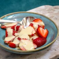 Fresh strawberries topped with creamy vanilla sauce.