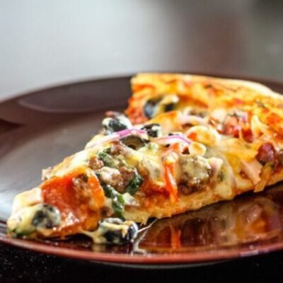 This pizza features a Creole seasoned pizza sauce.