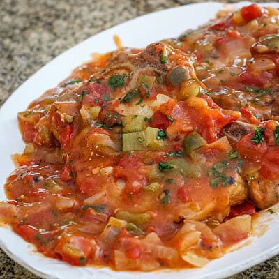 creole pork chops on a platter