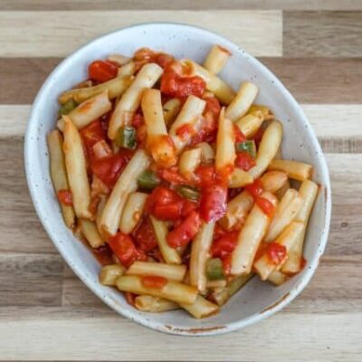 creole-style wax beans with tomatoes in a a small dish