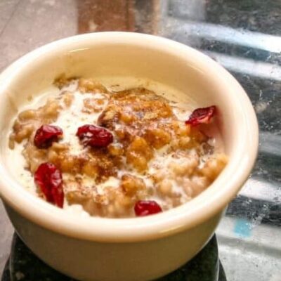 overnight oatmeal in a small bowl with dried cranberries