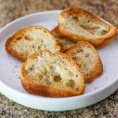 Simple seasoned crostini on a plate