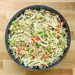 Fresh vegetable noodle salad with cabbage, carrots, and green onions.