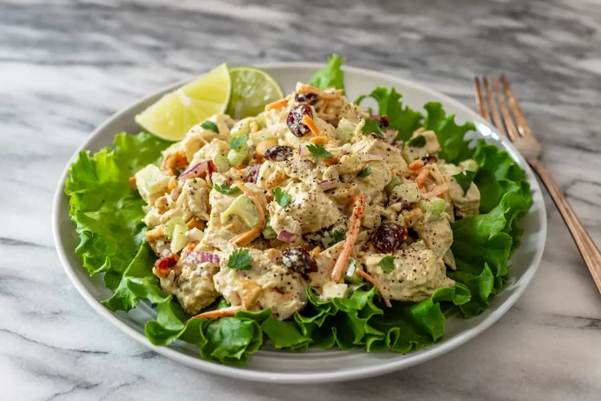 Curried chicken salad on a bed of lettuce.