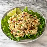 Creamy chicken salad with cranberries and fresh herbs.