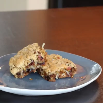 Homemade oatmeal cranberry cookies on a blue plate.