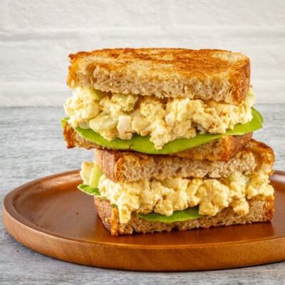 egg salad sandwich on toasted bread with lettuce