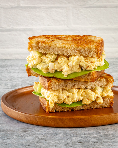 egg salad sandwich on toasted bread with lettuce