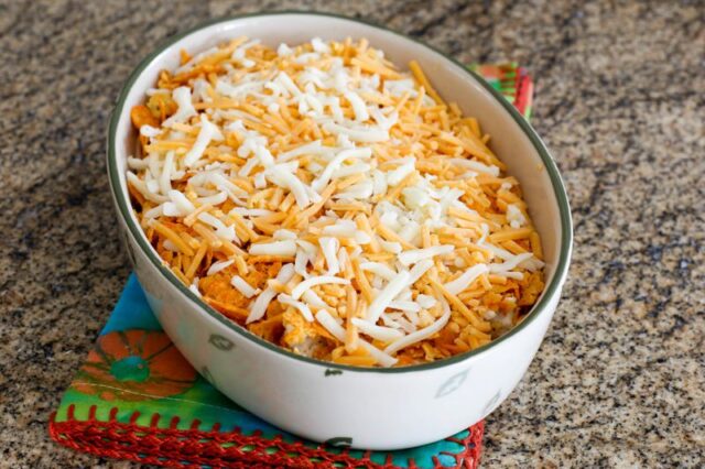 preparing the dorito casserole, ready to bake