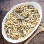 Creamy mushroom pasta with grated cheese and fresh herbs.