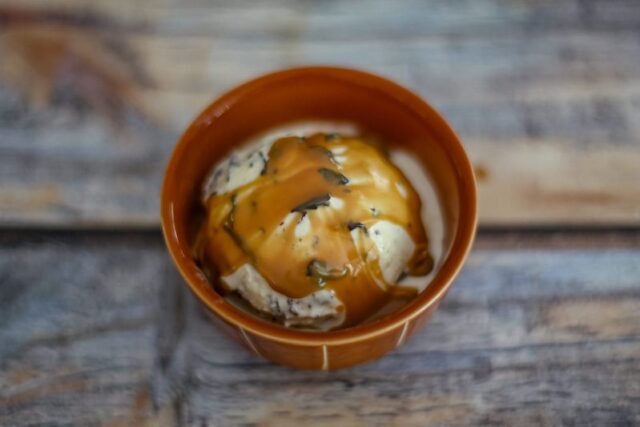 slow cooker dulce de leche on chocolate chip ice cream