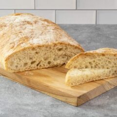 homemade ciabatta bread on a cutting board