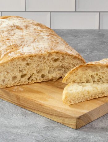 homemade ciabatta bread on a cutting board