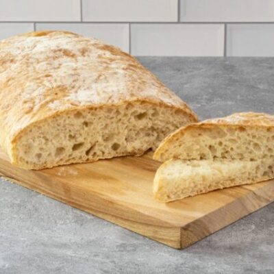 homemade ciabatta bread on a cutting board