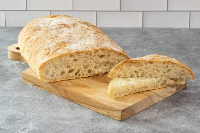 homemade ciabatta bread on a cutting board