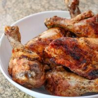 A serving dish with freshly grilled chicken.
