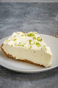 A slice of easy key lime pie on a dessert plate