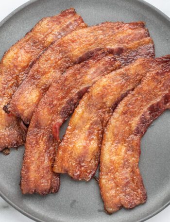 A plate of baked bacon.