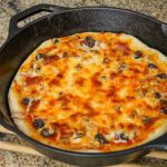 quick pizza sauce shown on a skillet pizza