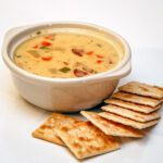 chicken chowder in a bowl with crackers