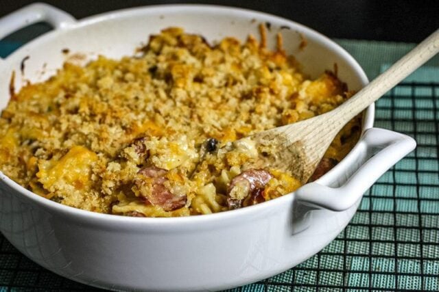 Farfalle, sausage, and cheese casserole in a baking dish.