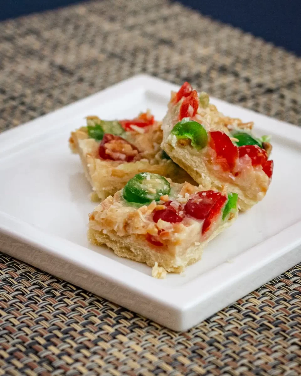 Festive shortbread squares with coconut and candied fruit.