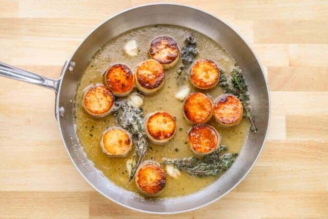 Golden seared scallops in a flavorful pan sauce.