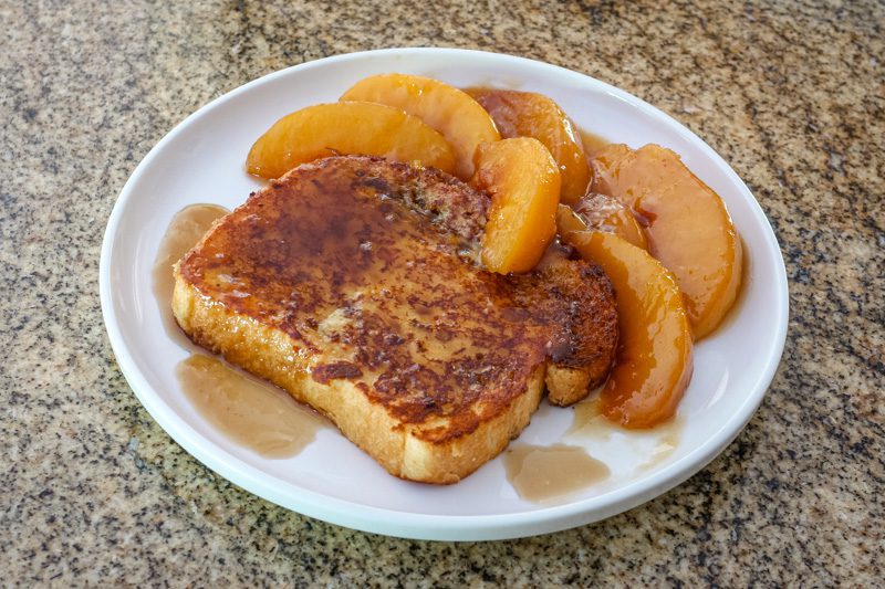 french toast with caramelized peaches and sauce
