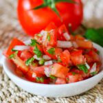 fresh salsa on a small plate (pico de gallo)