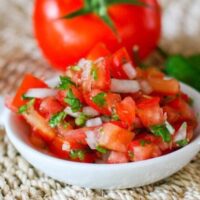fresh salsa on a small plate (pico de gallo)