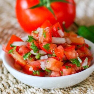 fresh salsa on a small plate (pico de gallo)