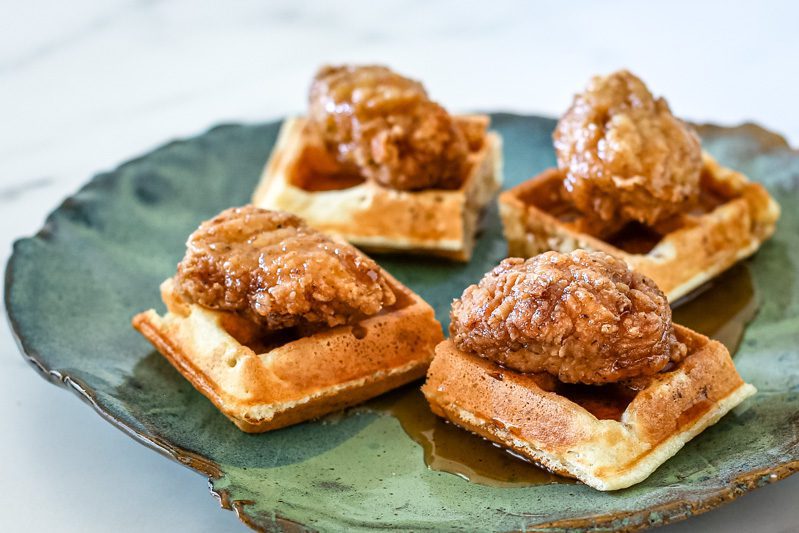 bite sized chicken on waffle squares