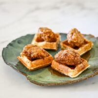 fried chicken served on waffle pieces as a snack.