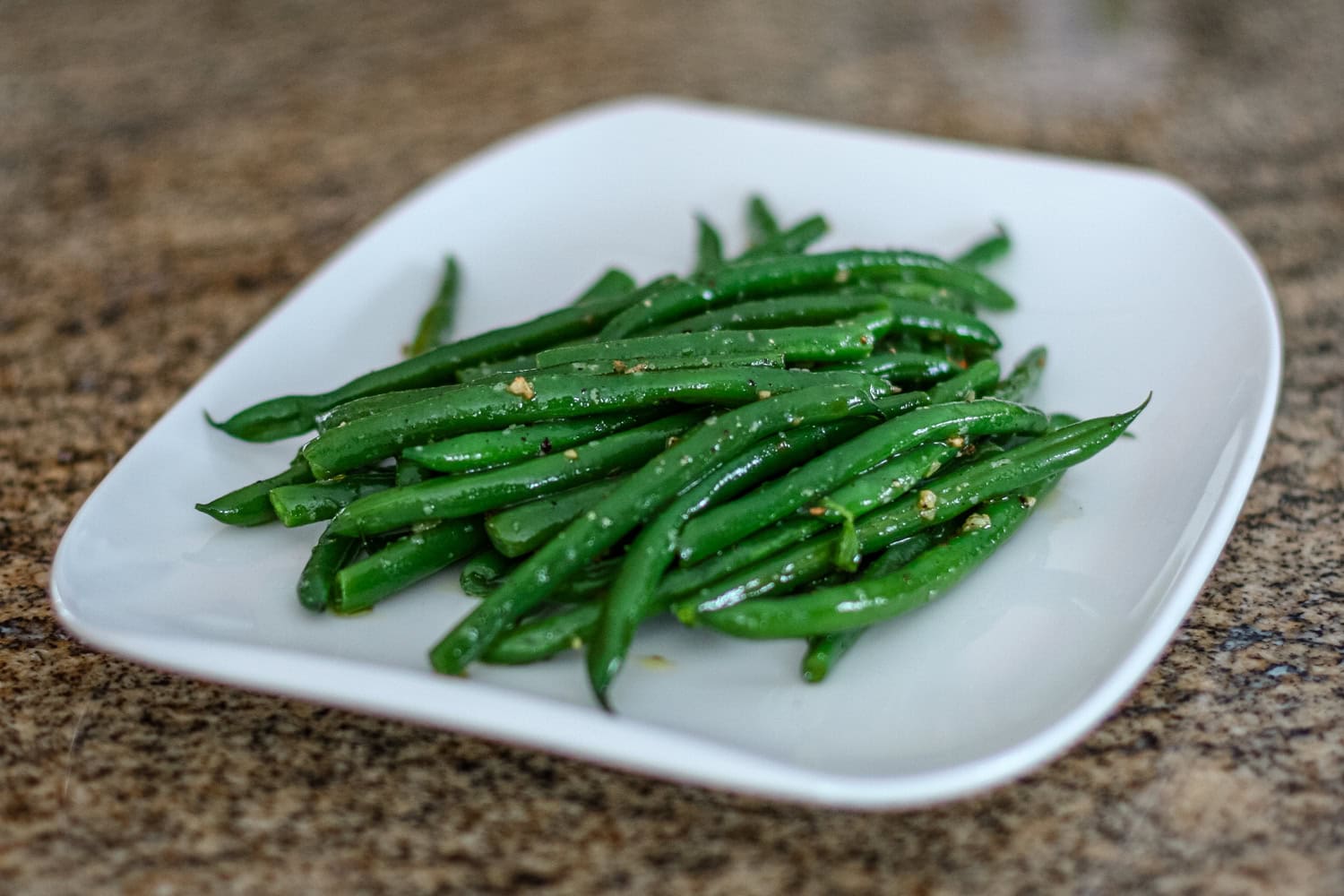 French green beans, haricots verts, on a plate.