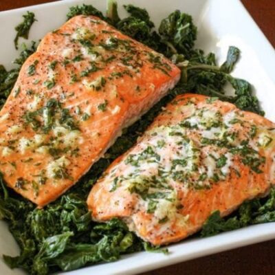 garlic and herb salmon on a bed of spinach
