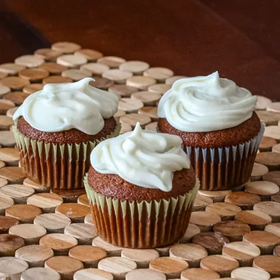 Rich chocolate cupcakes topped with creamy vanilla frosting.