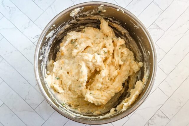 Mashing potatoes for a cottage pie.
