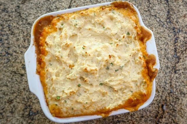 Baked cottage pie in the baking dish.