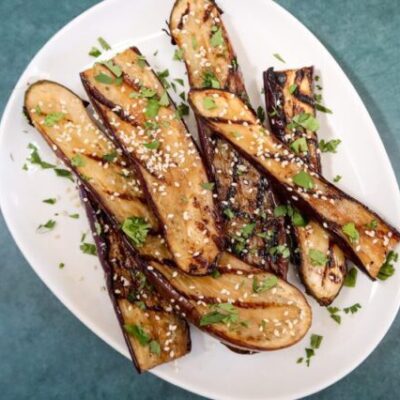 grilled chinese eggplant with sesame seeds garnish
