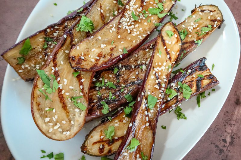 grilled chinese eggplant on a serving plate