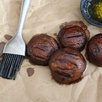 grilled mushrooms with basting sauce and brush