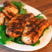 marinated grilled turkey tenderloins on a platter