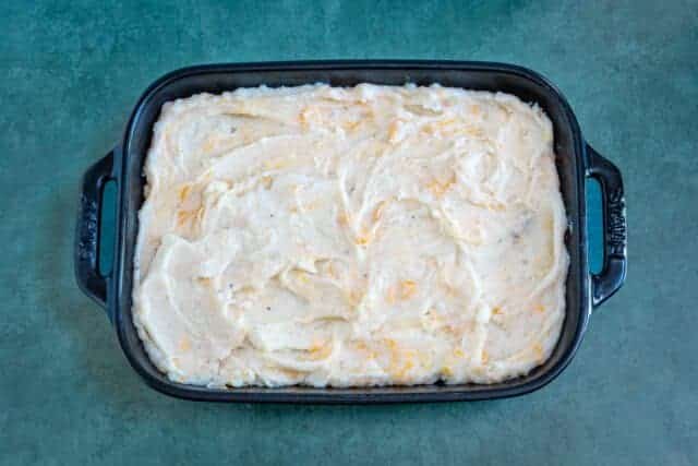 Creamy mashed potato casserole ready to bake.