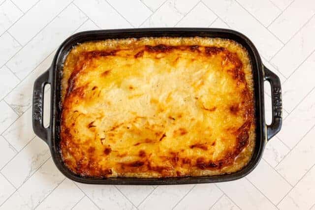 Creamy baked potato casserole with golden cheese topping.