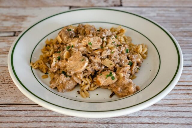 ground beef stroganoff over rice with sour cream sauce and mushrooms