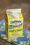 A carton of half-and-half on a countertop.