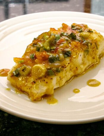 Halibut with a green onion and curry topping