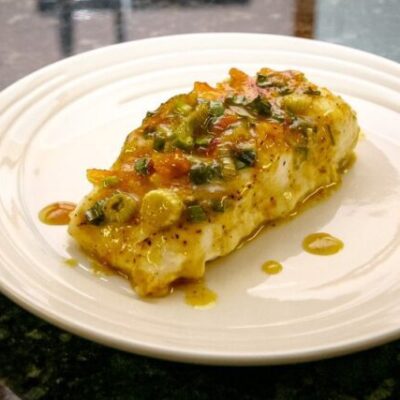 Halibut with a green onion and curry topping