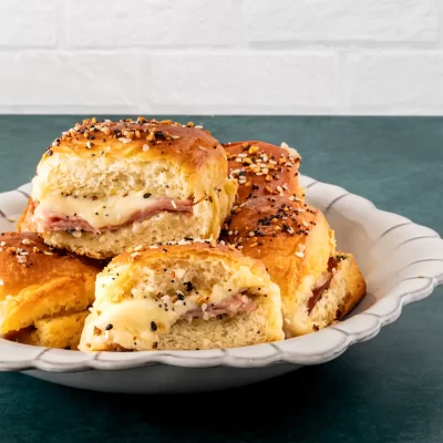 Buttery, filled biscuits topped with seasoning and herbs.